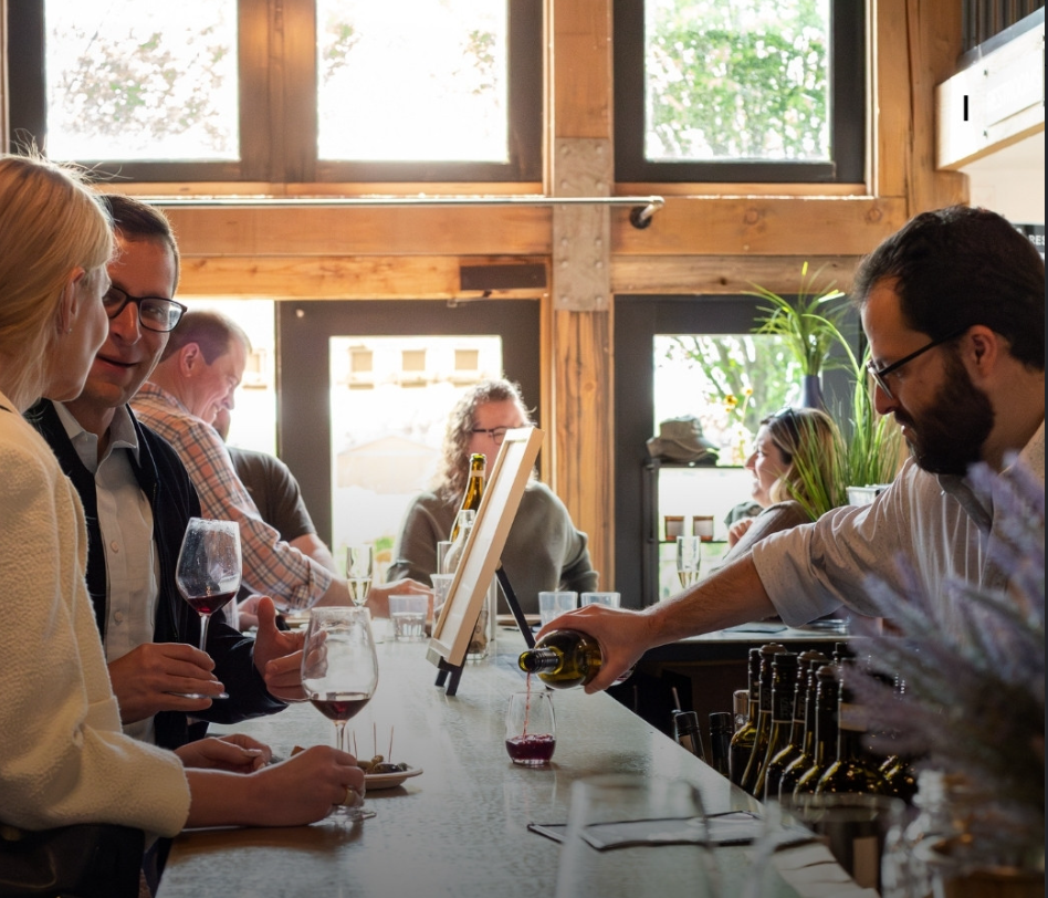 Close-up of wine being poured at a tasting