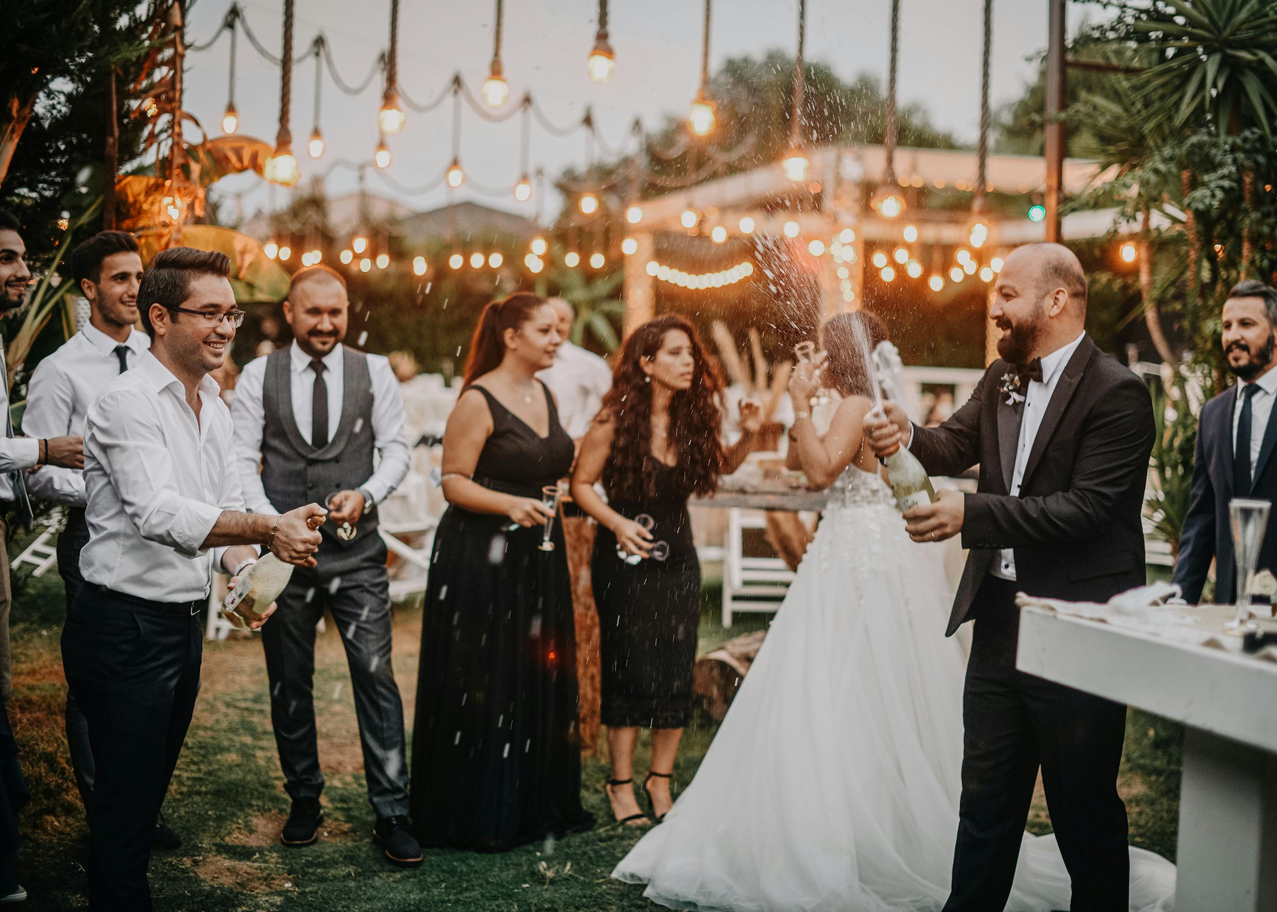 Couple celebrating with champagne at their wedding